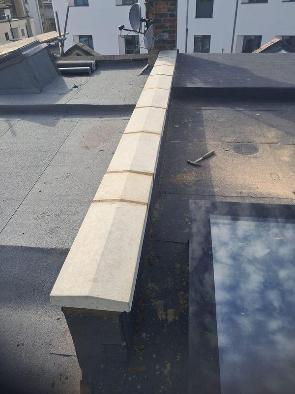 Flat roof finished with coping stones